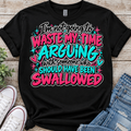 Black T-shirt featuring pink and teal Waste My Time Arguing quote design