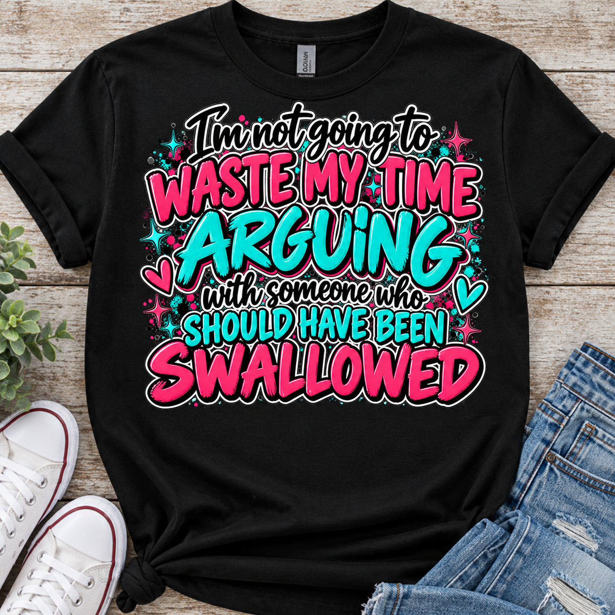 Black T-shirt featuring pink and teal Waste My Time Arguing quote design